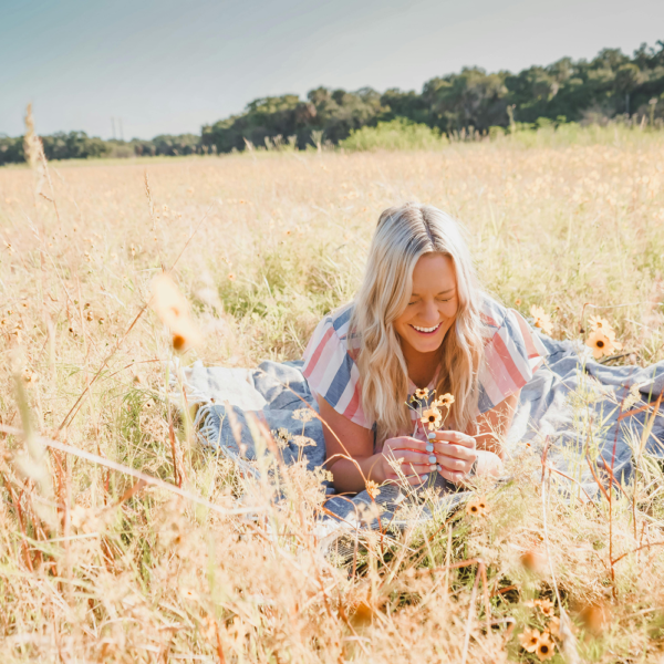 A 40-year-old woman in nature, representing strength and self-acceptance while living with lipedema.