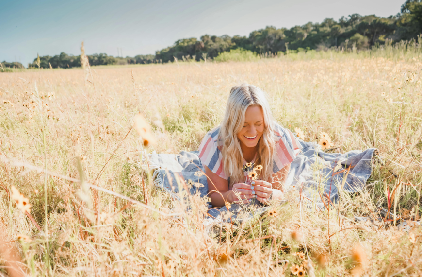 A 40-year-old woman in nature, representing strength and self-acceptance while living with lipedema.