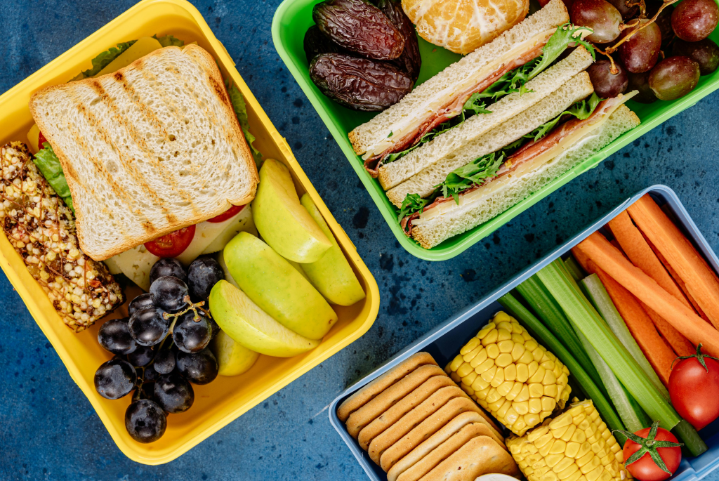 Lunchboxes packed for teens with sandwiches, grapes, cheese cubes, and healthy snacks — ideal for back to school meals.