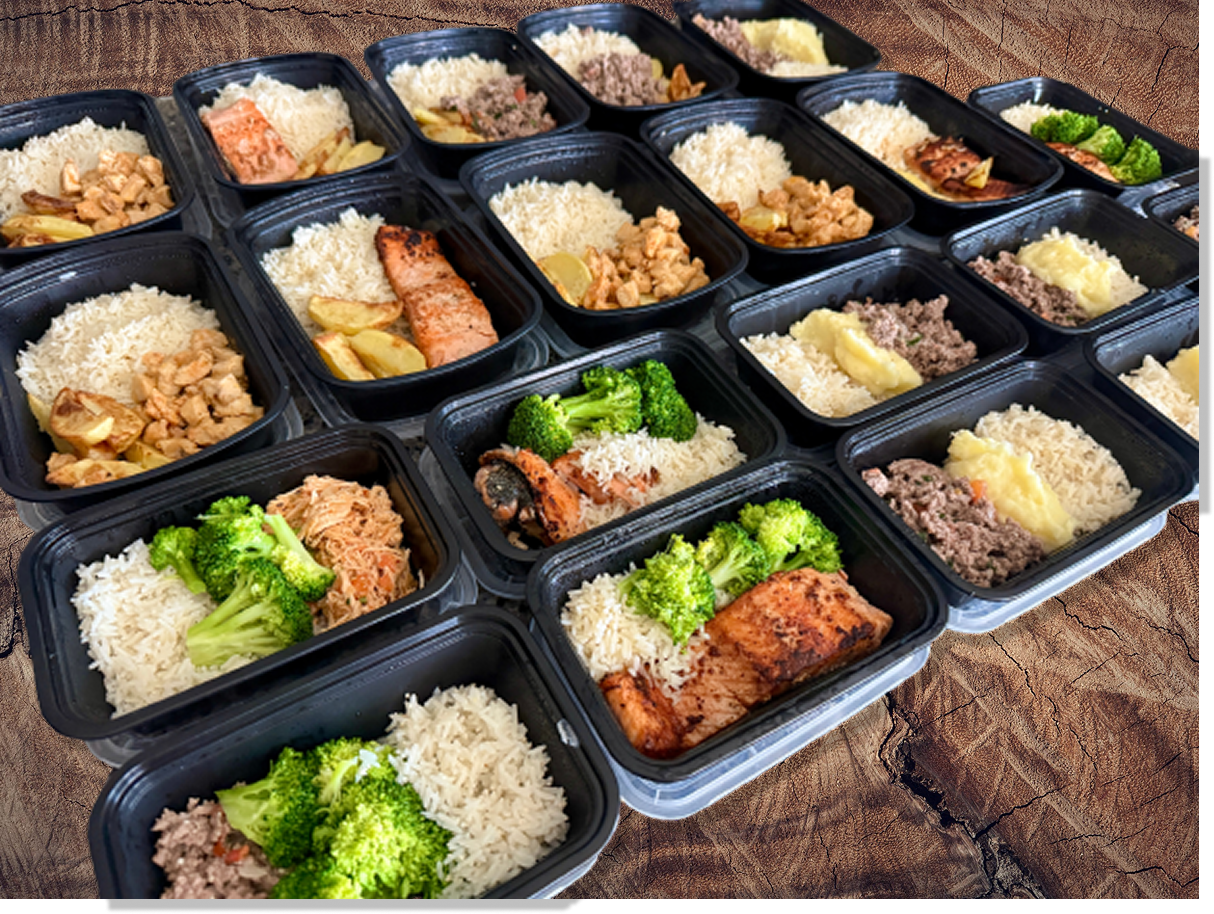 Meal prep containers with healthy family meals, including rice, vegetables, and proteins, neatly arranged on a wooden table.