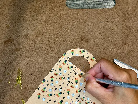 Cutting details of Halloween Treat Bags with craft knife.