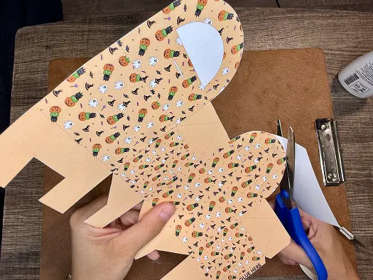 Cutting the shape of Halloween Treat Bags..