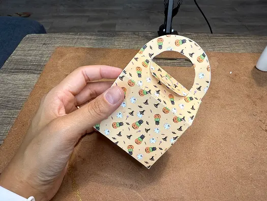 Filling the Halloween Treat Bag with treat.