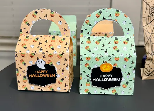 Putting the tags in front of the Halloween Treat Bags..