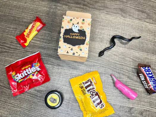 Filling the Halloween Treat Bag with candy