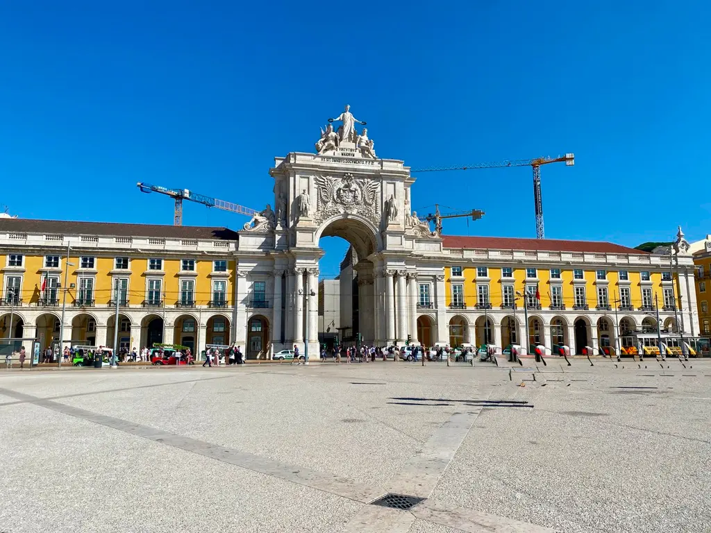 Arco da Rua Augusta arch with people walking beneath in Lisbon