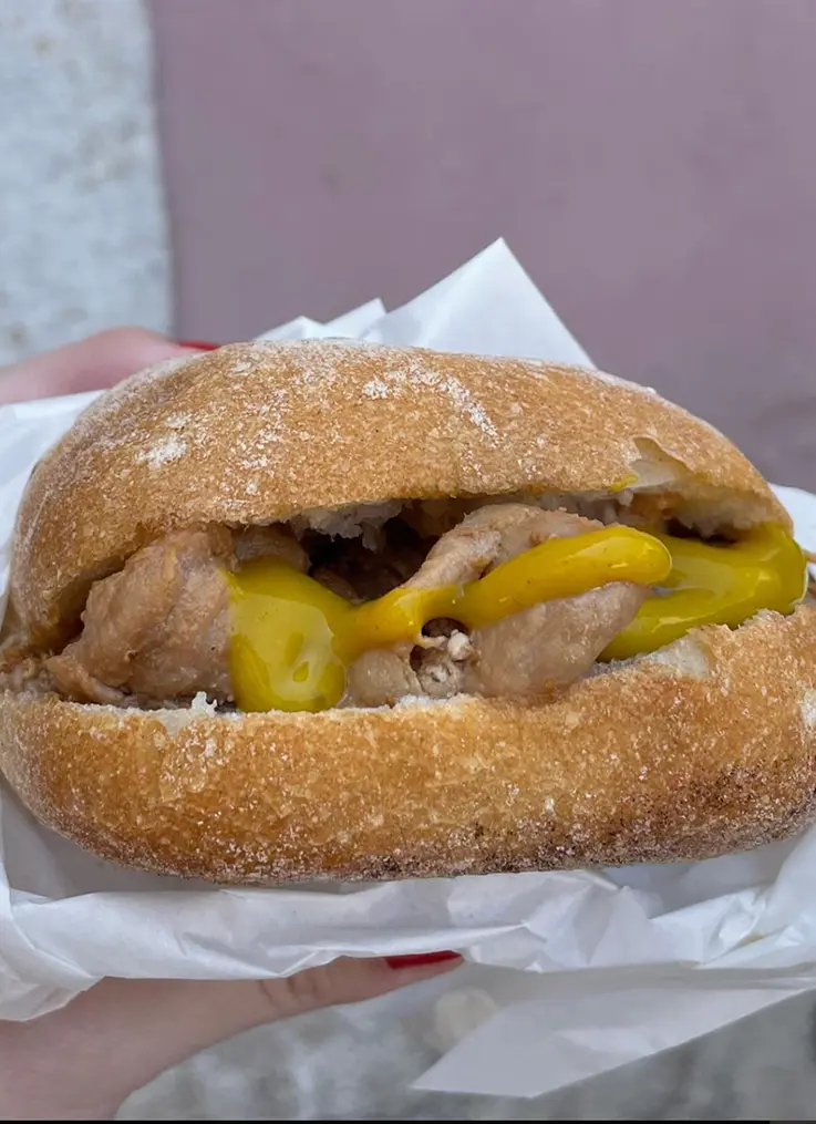 Bifana pork sandwich in Portuguese bread roll
