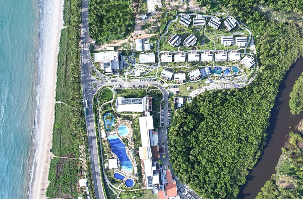 Aerial view of the entire hotel complex with pools and buildings