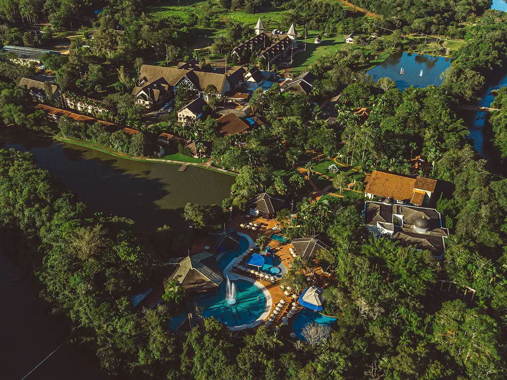 View of the hotel complex with buildings, gardens and pool