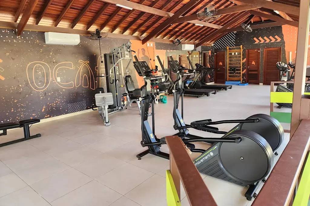 Modern gym with elliptical, treadmill, and exercise bike