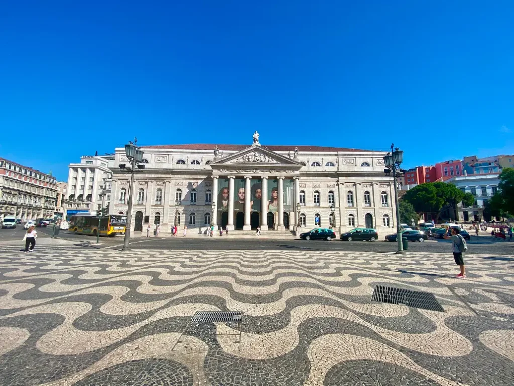 Rossio Square in Lisbon with patterned pavement and historic buildings