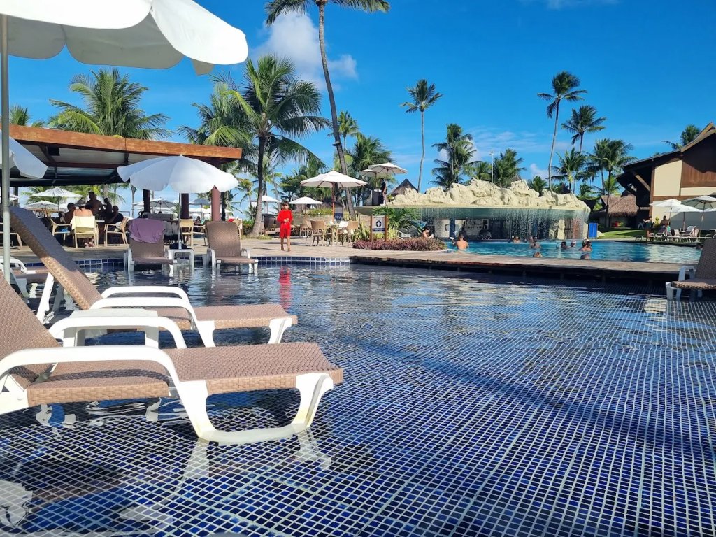 Pool of hotel with sun chairs