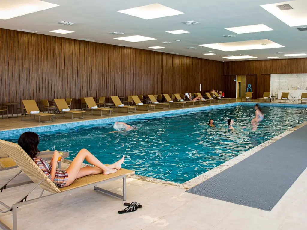 Indoor swimming pool with lounge chairs